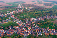 Village - view on the edge of agricultural fields and farmland in Riedseltz in Grand Est, France out of the air