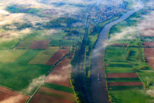B27 and railway line on the Neckar under clouds in Offenau in the state Baden-Wuerttemberg, Germany