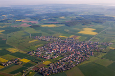 Village - view on the edge of agricultural fields and farmland in Kleinrinderfeld in the state Bavaria, Germany