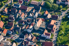 Aerial photograpy of Village - view on the edge of agricultural fields and farmland in Kleinrinderfeld in the state Bavaria, Germany