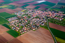 Aerial view of Village - view on the edge of agricultural fields and farmland in Oberpleichfeld in the state Bavaria, Germany