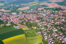 Aerial view of Village - view on the edge of agricultural fields and farmland in Schwanfeld in the state Bavaria, Germany