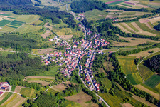 Aerial view of Village - view on the edge of agricultural fields and farmland in Zimmern unter der Burg in the state Baden-Wurttemberg, Germany