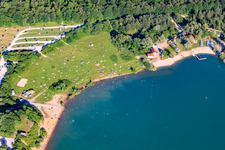 Sunbathing lawn at Epplesee covered with bathers in the district Silberstreifen in Rheinstetten in the state Baden-Wuerttemberg, Germany from above