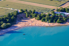 Nudist beach Epplesee crowded with bathers in the district Forchheim in Rheinstetten in the state Baden-Wuerttemberg, Germany seen from above