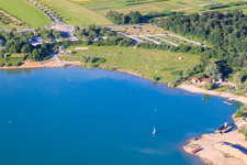 Sunbathing lawn at Epplesee full of bathers in the district Silberstreifen in Rheinstetten in the state Baden-Wuerttemberg, Germany