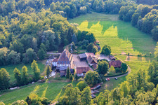 Bienwaldmühle grain mill on the Lauter in Scheibenhardt in the state Rhineland-Palatinate, Germany seen from above