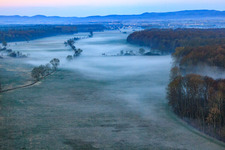 Aerial view of Otterbach lowlands in the morning mist in Freckenfeld in the state Rhineland-Palatinate, Germany