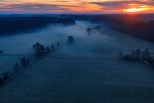 Otterbach lowlands in the morning mist at sunrise in Minfeld in the state Rhineland-Palatinate, Germany