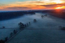 Aerial view of Otterbach lowlands in the morning mist at sunrise in Minfeld in the state Rhineland-Palatinate, Germany