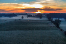 Otterbach lowlands in the morning mist at sunrise in Minfeld in the state Rhineland-Palatinate, Germany seen from above