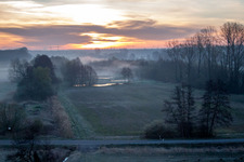 Aerial view of Sunrise haze at structures of a field landscape Otterbachtal in Minfeld in the state Rhineland-Palatinate