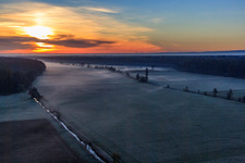 Aerial view of Bruchbach in the Otterbach lowlands in the morning mist at sunrise in Freckenfeld in the state Rhineland-Palatinate, Germany