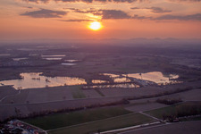 Colorful sunset over the countryside in Neupotz in the state Rhineland-Palatinate dyes the sky purple and orange