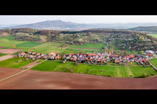 Village - view on the edge of agricultural fields and farmland in Schlechtsart in the state Thuringia, Germany