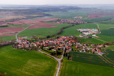 Village - view on the edge of agricultural fields and farmland in Simmershausen in the state Thuringia, Germany