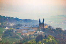 Aerial view of Banz Monastery with the monastery church of St. Dionysius and St. Peter on a mountain above the Main in the district Unnersdorf in Bad Staffelstein in the state Bavaria, Germany