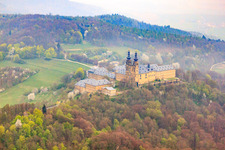 Aerial photograpy of Banz Monastery with the monastery church of St. Dionysius and St. Peter on a mountain above the Main in the district Unnersdorf in Bad Staffelstein in the state Bavaria, Germany
