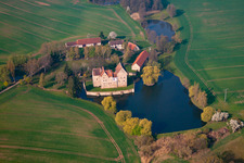 Oblique view of Buildings and castle park - facilities of the moated castle Brennhausen in the district Brennhausen in Sulzdorf an der Lederhecke in the state Bavaria, Germany