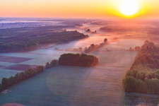 Sunrise over the Otterbach lowlands in the morning mist in Minfeld in the state Rhineland-Palatinate, Germany