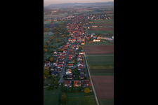 Village - view on the edge of agricultural fields and farmland in Freckenfeld in the state Rhineland-Palatinate, Germany from above