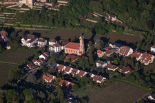 Village - view on the edge of agricultural fields and farmland in Haardt an der Weinstraße in the state Rhineland-Palatinate, Germany