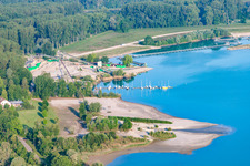 Sailing yachts, beach and Heidelberg Materials Mineralik at the Giessen quarry lake in the district Liedolsheim in Dettenheim in the state Baden-Wuerttemberg, Germany