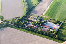 Barn building on the edge of agricultural fields and farmland Semler Rollrasen in Philippsburg in the state Baden-Wurttemberg, Germany