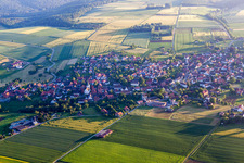 Village - view on the edge of agricultural fields and farmland in Ottenstein in the state Lower Saxony, Germany