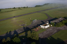 Runway with tarmac terrain of airfield Hoexter-Holzminden with morning mist in the district Brenkhausen in Hoexter in the state North Rhine-Westphalia, Germany