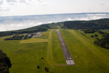 Aerial photograpy of Runway with tarmac terrain of airfield Hoexter-Holzminden with morning mist in the district Brenkhausen in Hoexter in the state North Rhine-Westphalia, Germany
