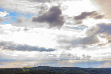 Wind farm during a thunderstorm in the district Lütmarsen in Höxter in the state North Rhine-Westphalia, Germany