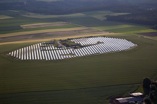 Aerial view of Panel rows of photovoltaic and solar farm or solar power plant in Beverungen in the state North Rhine-Westphalia