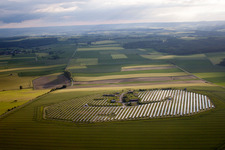 Aerial photograpy of Panel rows of photovoltaic and solar farm or solar power plant in Beverungen in the state North Rhine-Westphalia