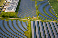 Aerial photograpy of Panel rows of photovoltaic and solar farm or solar power plant in the district Bredenborn in Marienmuenster in the state North Rhine-Westphalia