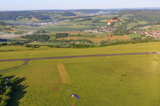 Parachute field at the Höxter-Holzminden airfield (EDVI) in the district Albaxen in Höxter in the state North Rhine-Westphalia, Germany from the plane