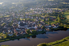 Aerial view of Town on the banks of the river of the Weser river in the district Luechtringen in Hoexter in the state North Rhine-Westphalia, Germany