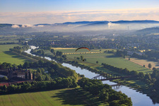 Aerial view of Corvey Castle/Monastery (UNESCO World Heritage Site) on the river - bridge structure over the Weser in Höxter in the state North Rhine-Westphalia, Germany