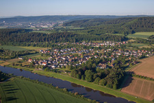 Village on the river bank areas of the Weser river in Wehrden in the state North Rhine-Westphalia, Germany