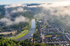 Aerial view of Old town and Weser Bridge under low clouds in Bad Karlshafen in the state Hesse, Germany