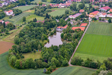 Swimming lake at the old swimming pool in Arnstein in the state Bavaria, Germany