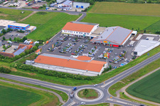 Industrial estate and company settlement with EDEKA Müller, Netto, KiK and Werntal-Apotheke in Werneck in the state Bavaria, Germany