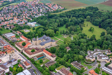 Castle park and castle Werneck with castle church and Albert Schweitzer House in Werneck in the state Bavaria, Germany from above