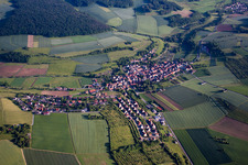 Village - view on the edge of agricultural fields and farmland in Unteraltertheim in the state Bavaria, Germany