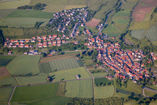 Aerial view of Village - view on the edge of agricultural fields and farmland in Unteraltertheim in the state Bavaria, Germany