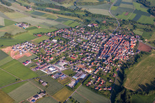 Aerial view of Village - view on the edge of agricultural fields and farmland in Werbach in the state Baden-Wurttemberg, Germany
