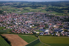 Aerial view of Village - view on the edge of agricultural fields and farmland in Laichingen in the state Baden-Wurttemberg, Germany