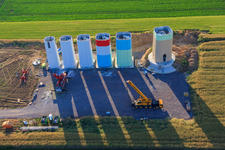 Aerial view of Interlocking segments of the masts of a wind turbine before assembly in Offenbach an der Queich in the state Rhineland-Palatinate, Germany