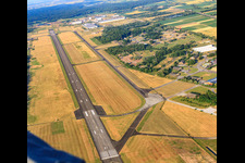 Aerial view of Runway of the Lahrer Flugbetriebs GmbH airfield in the district Schuttern in Friesenheim in the state Baden-Wuerttemberg, Germany