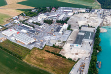 Aerial view of Mixed concrete and building materials factory of Birkenmeier Stein+Design in Gravel mine in the district Niederrimsingen in Breisach am Rhein in the state Baden-Wurttemberg, Germany